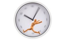 figure running on a hamster-wheel type blurry clockface